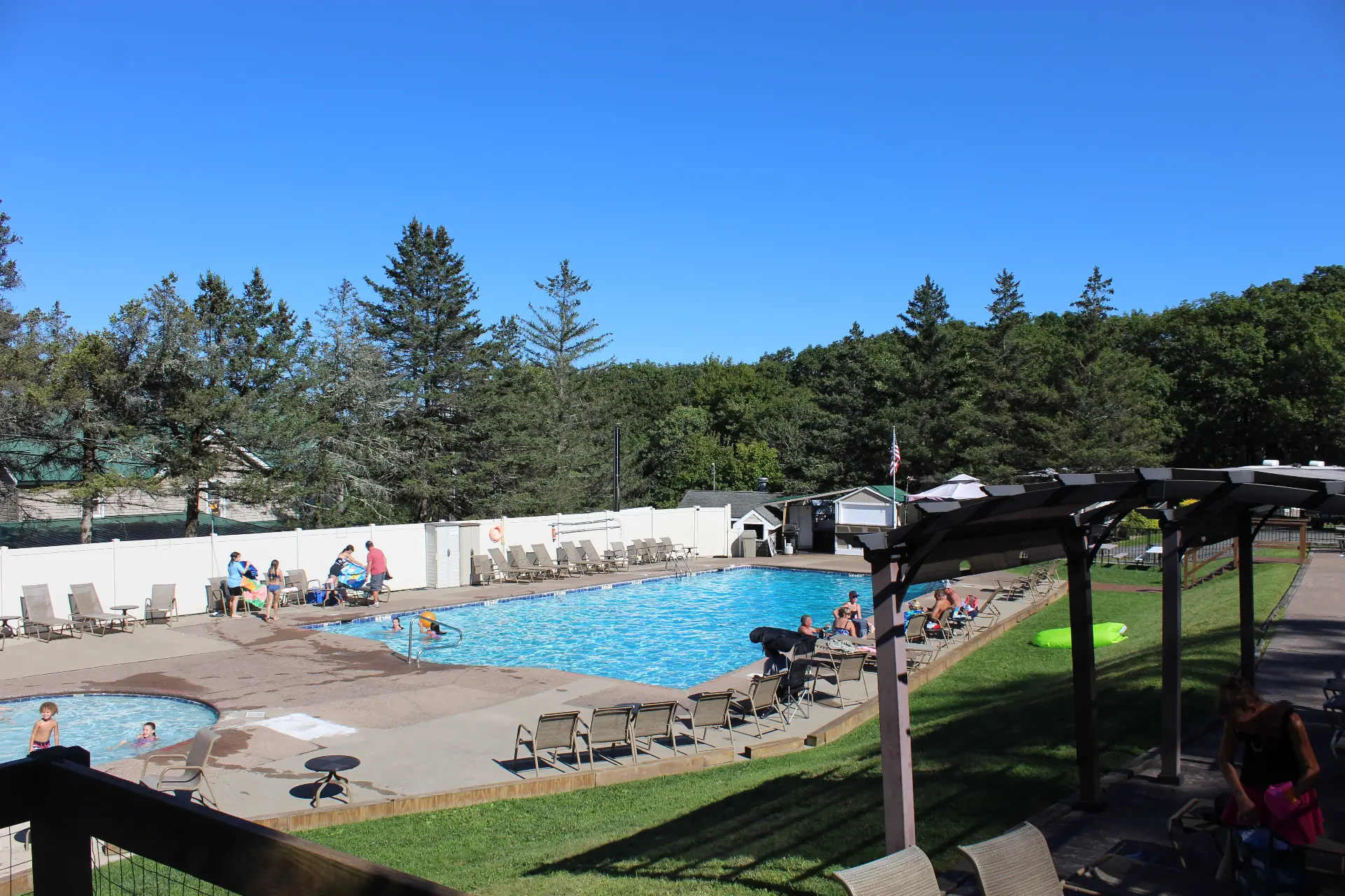 Guests swimming and relaxing at the heated outdoor pool